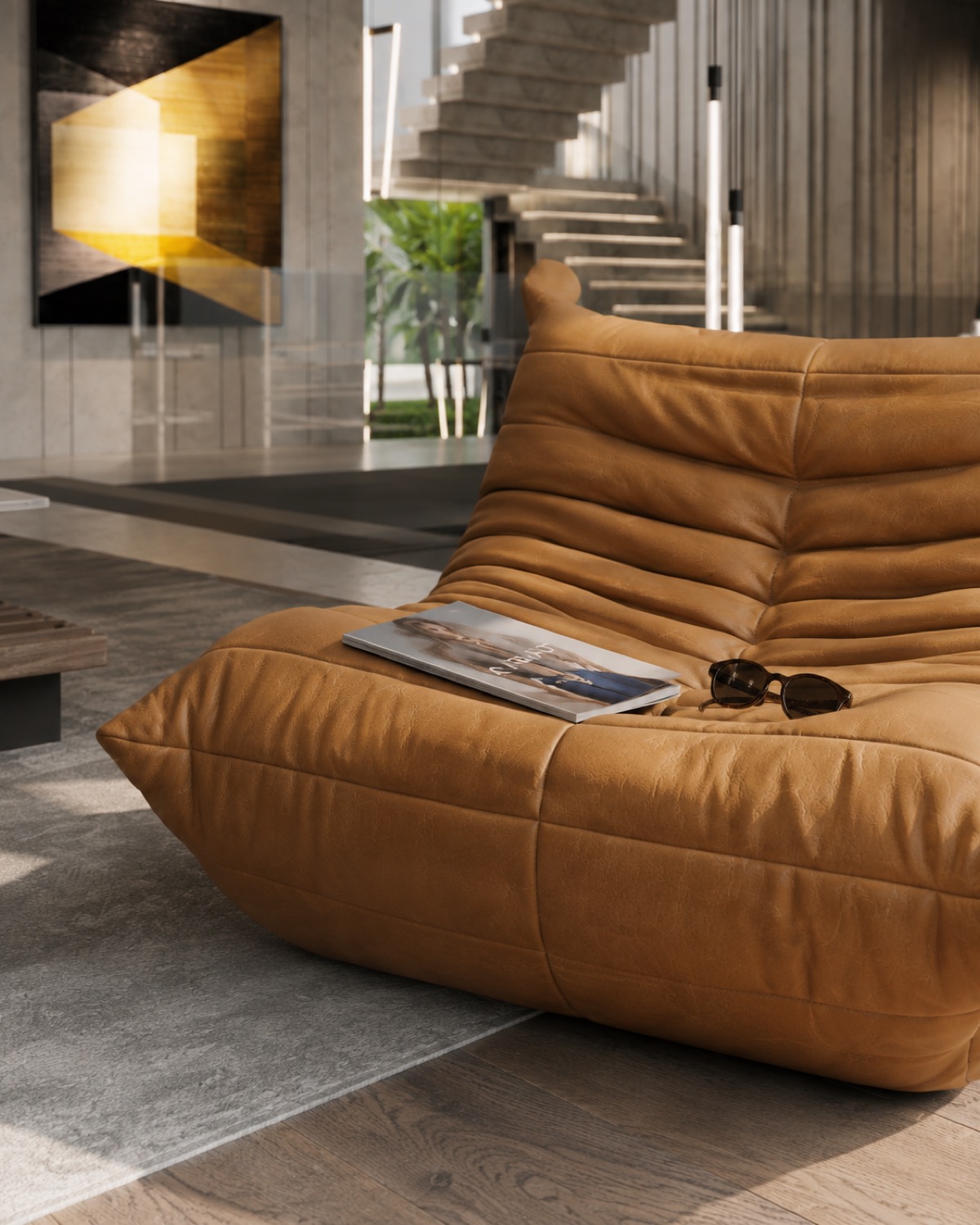 The full Togo lounge chair with a magazine and sunglasses, CT Villa