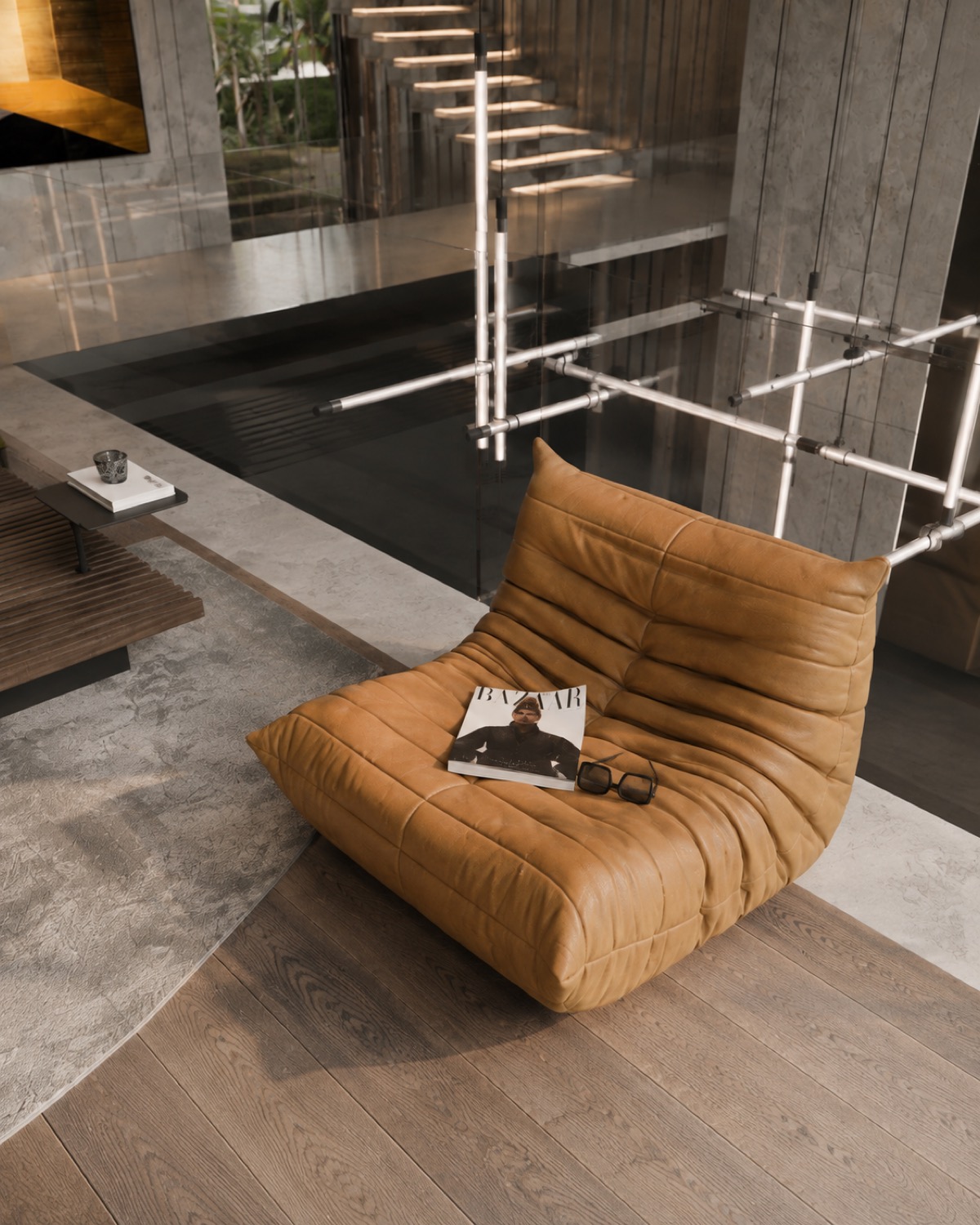 Togo lounge styled with a magazine and sunglasses