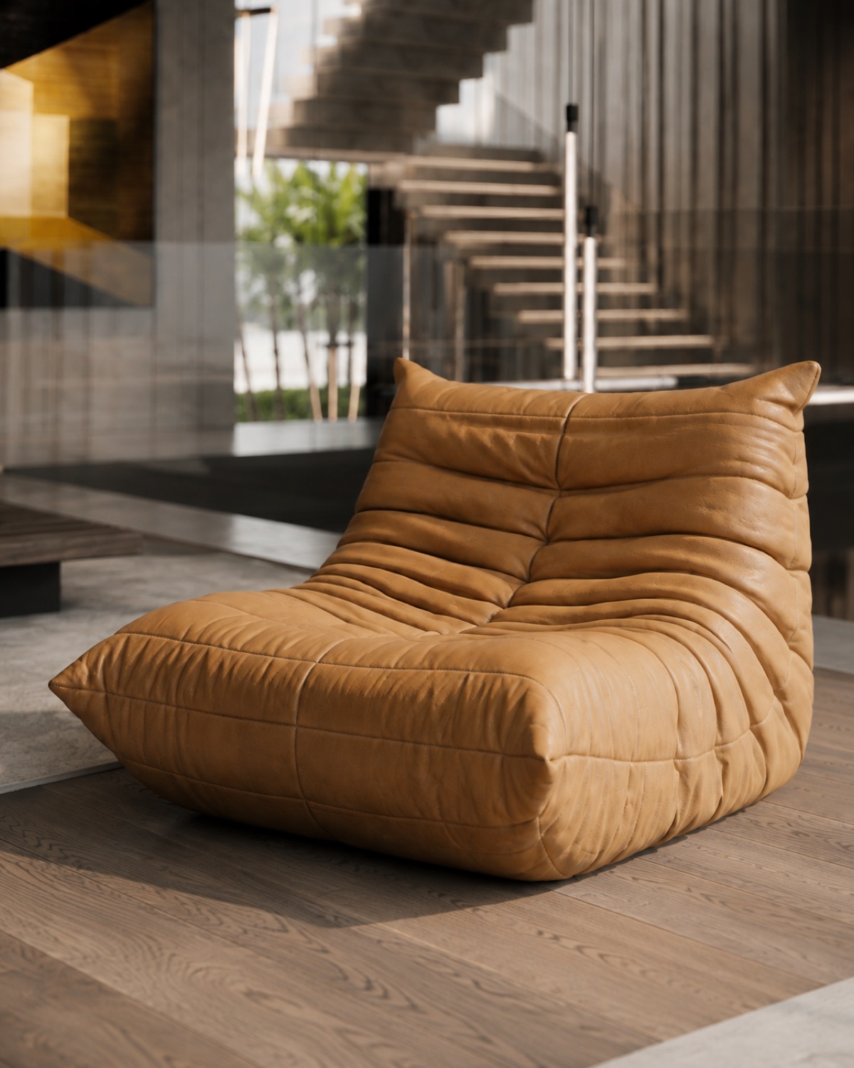 Side profile of the caramel Togo lounge chair at CT Villa